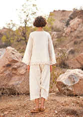 A Model Wearing White Cotton Mul Shuchi Salwar Pants,curated by Only Ethikal